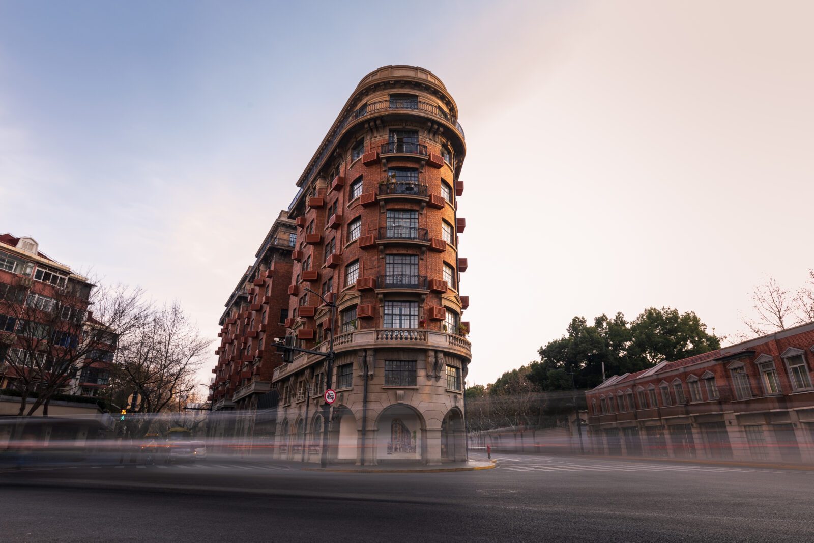 Long exposure picture of Wukang building and passing traffic in Shanghai