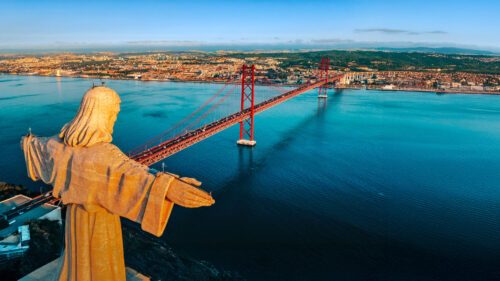 Aerial view of Sanctuary of Christ the King, Santuario de Cristo Rei in Lisbon, Portugal. Drone photo at sunrise. Catholic monument Aerial view of Sanctuary of Christ the King, Santuario de Cristo Rei in Lisbon, Portugal. Drone photo at sunrise. Catholic monument