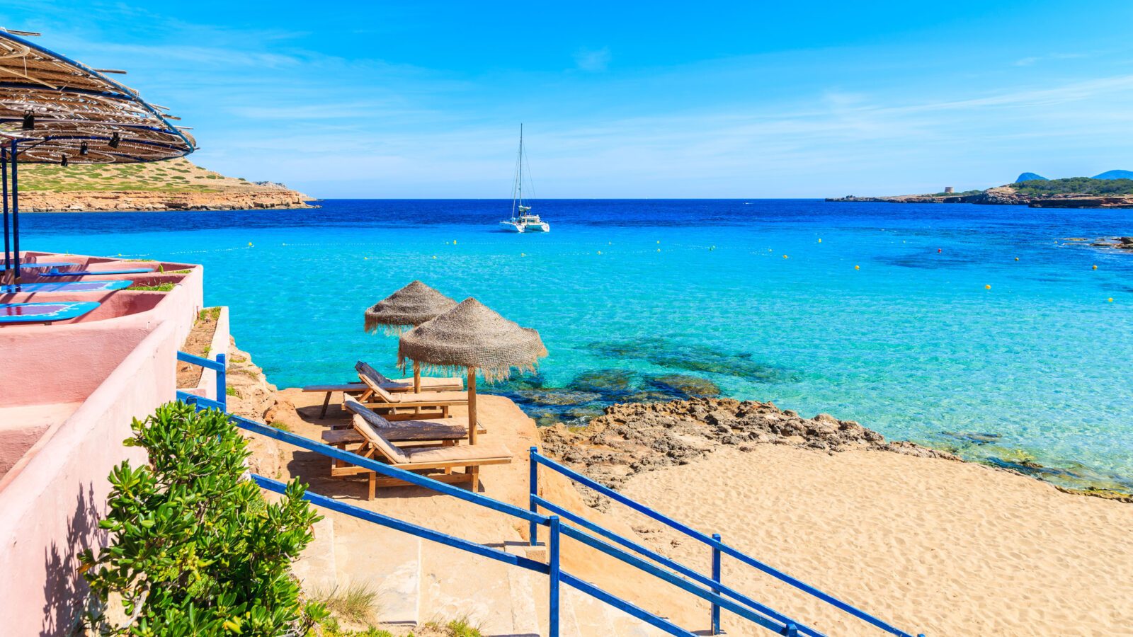 Steps from coastal bar to Cala Comte beach, Ibiza island, Spain