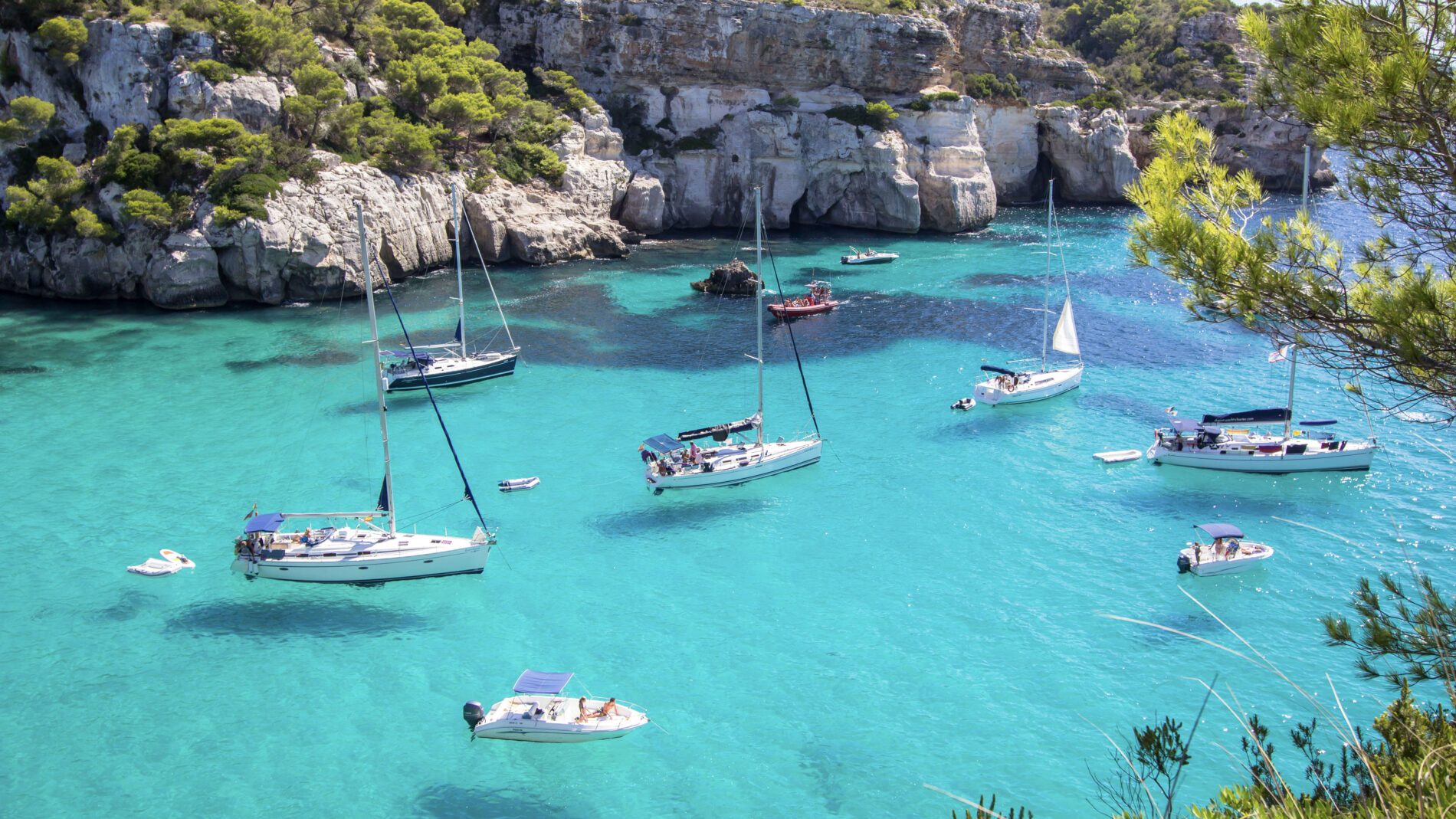 Boats and yachts on Macarella beach, Menorca, Spain