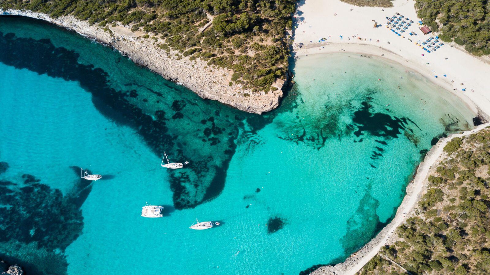 Aerial: The beach of Cala Mondrago in Mallorca, Spain