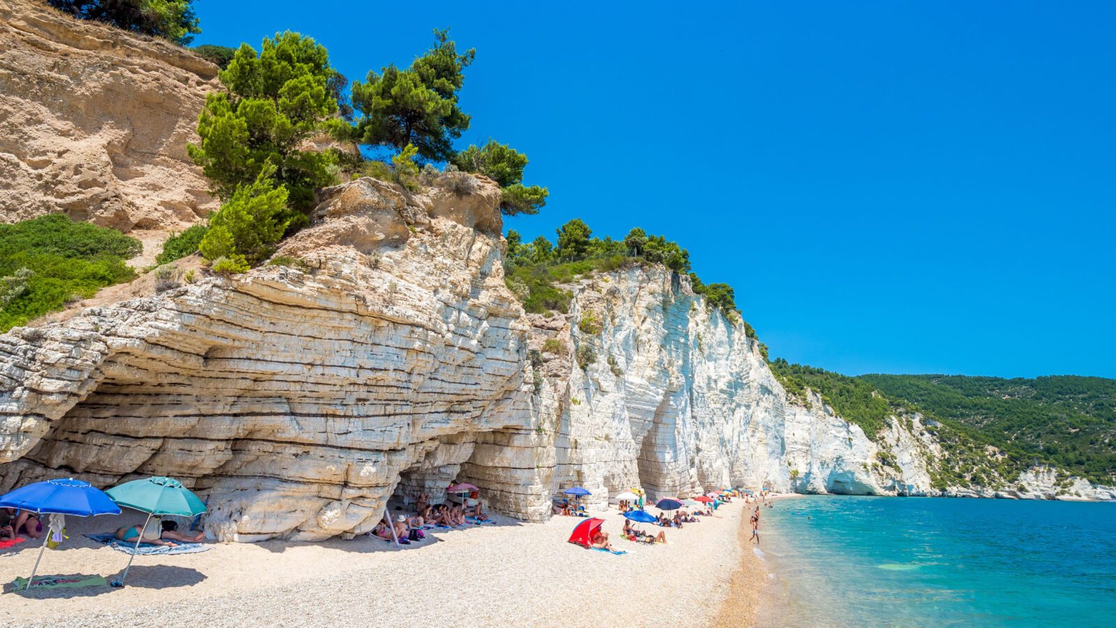 Faraglioni stacks and beach coast of Baia Delle Zagare, Gargano, Apulia, Italy