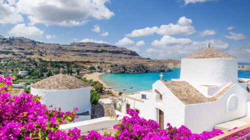 Landscape with beach and white church in Lindos, Rhodes, Greece